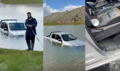 Göletten geçmek isterken aracıyla mahsur kaldı, yardımına arkadaşları yetişti